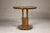 A Midcentury wooden side table with round top, column-shaped supports and tambour base. This Midcentury wooden side table...