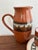 Artisanal studio pottery set, made in Peru. Includes a pitcher, three mugs, and a serving plate. Hand painted with a...