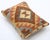 A one-of-a-kind handwoven Afghan wool kilim lumbar pillow featuring concentric diamond medallion. Cut and sewn by hand...