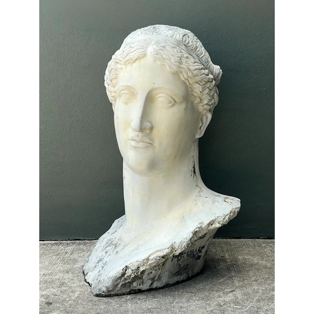 This monumental fiberglass sculpture captures the serene countenance of a Roman goddess, rendered in the Neoclassical...