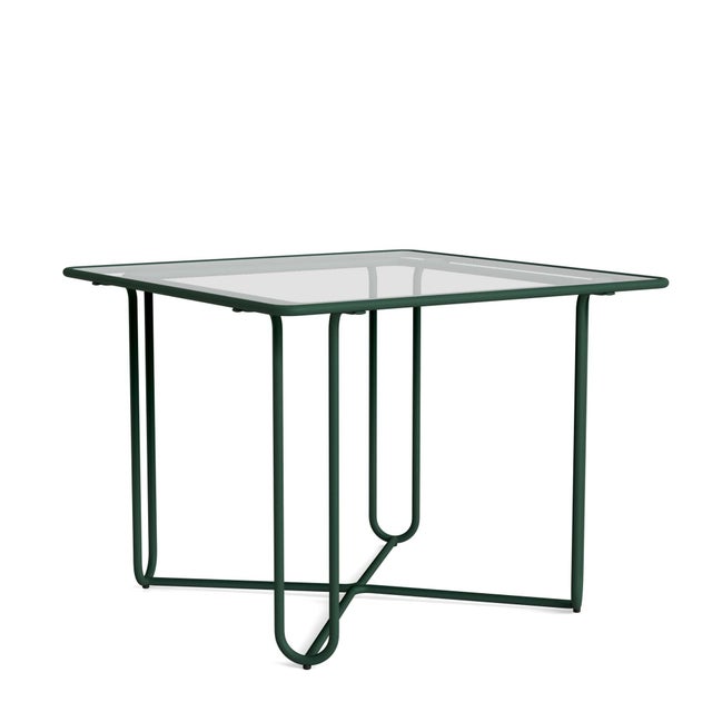 A free flowing frame design and transitional glass tabletop define the Walter Lamb Aluminum 20" Round Occasional Table....