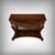 This elegant mahogany and mahogany burl veneer console table with a mirrored top captivates with the richness of its grain...