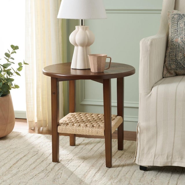 Introducing the Rakoma End Table, a delightful blend of style and stability. Sporting a charming walnut shade, this piece...