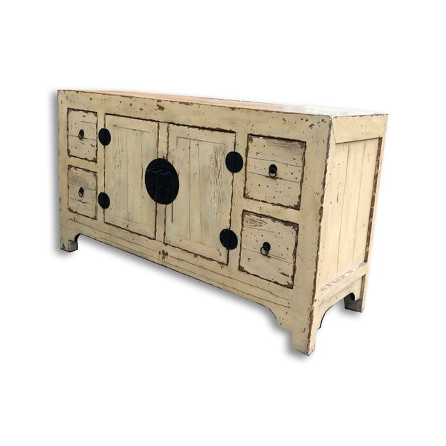 An amazing and beautiful butter yellow distressed Ming style buffet or console. This would make an excellent hallway piece...