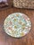 This is a set of four ceramic plates featuring exquisite floral patterns. These plates are a wonderful way to add color...