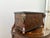 Aries motif storage box. Large decorative box with two ram heads sentinels at each front corner. In a burlwood, faux inlay...