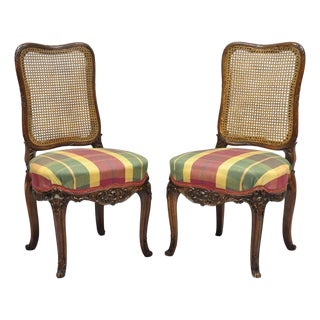 Antique French Country Louis XV Carved Walnut Cane Back Side Chairs - A Pair For Sale