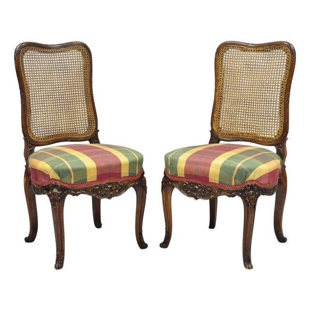 Antique French Country Louis XV Carved Walnut Cane Back Side Chairs - A Pair For Sale