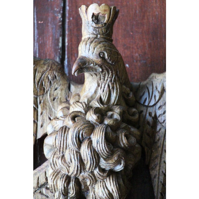 With its symmetrical design and decor, this "original" and "timeless" Baroque Bird Wearing a Crown sculpture is an...