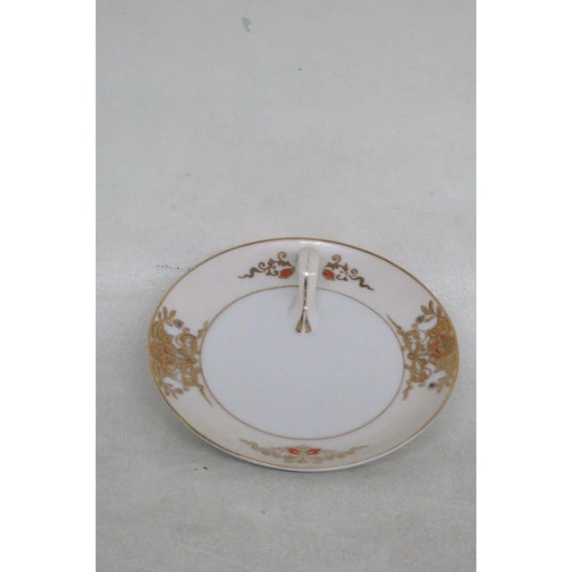 This lovely lemon dish is made of porcelain. This dish is stamped as being made by Noritake in Japan and "U.S. Design Pat....