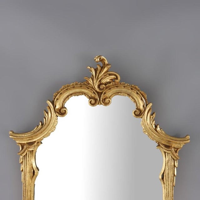 This elegant LaBarge wall mirror presents a refined French Louis XVI style, expertly crafted in the 20th century. The...