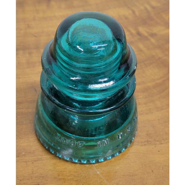 This is a gorgeous aqua or teal vintage glass Hemingray insulator. Tons of insulators in stock with varying colors, sizes,...