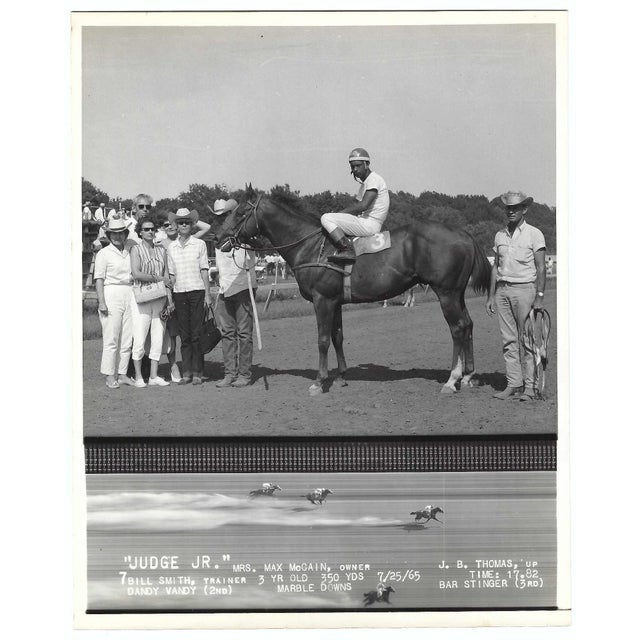 July 1965 black and white photograph of Judge Jr in the winner's circle at Marble Downs in Carthage, Missouri. African...