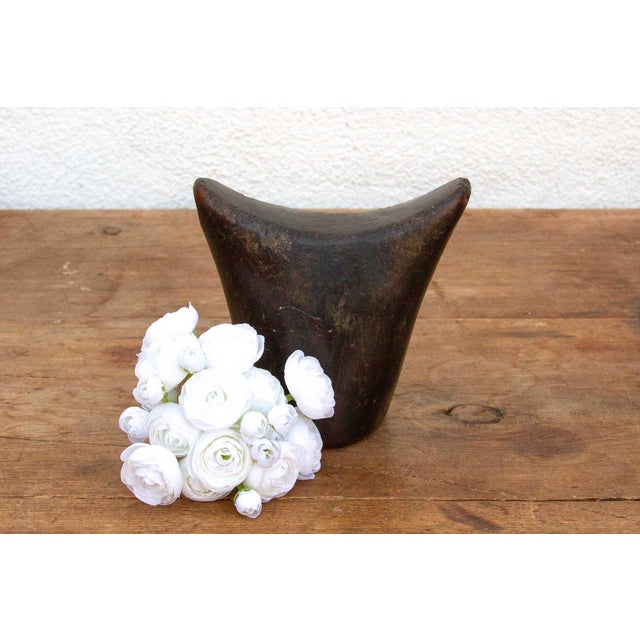This antique Sidama headrest is more than just a piece of wood; it's a testament to the artistry and traditions of...