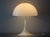 The Panthella desk lamp was designed in 1971 by Verner Panton for Louis Poulsen and is one of the icons of Danish design....