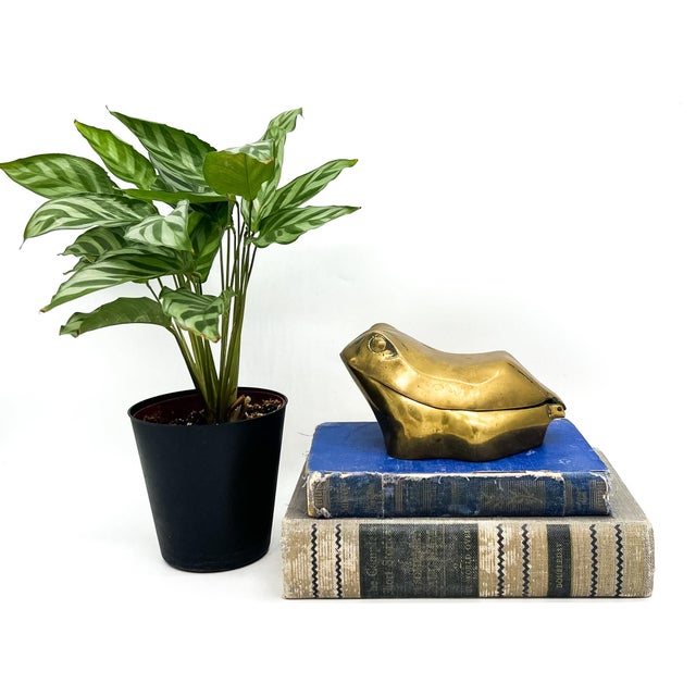 Charming, mid-late 20th century brass trinket box cast in the form of a resting frog. With its sculptural silhouette,...