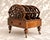An elegant 19th-century Victorian English magazine rack, crafted entirely from wood and resting on four turned feet with...