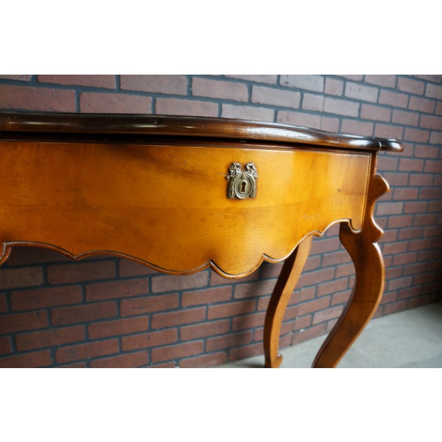 Country French console table by Milling Road a division of Baker Furniture. Finely crafted of maple in Italy and featuring...
