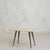 An Italian coffee table from the 1950s, composed of a softly rounded onyx top resting on tapered brass legs. The slab is...