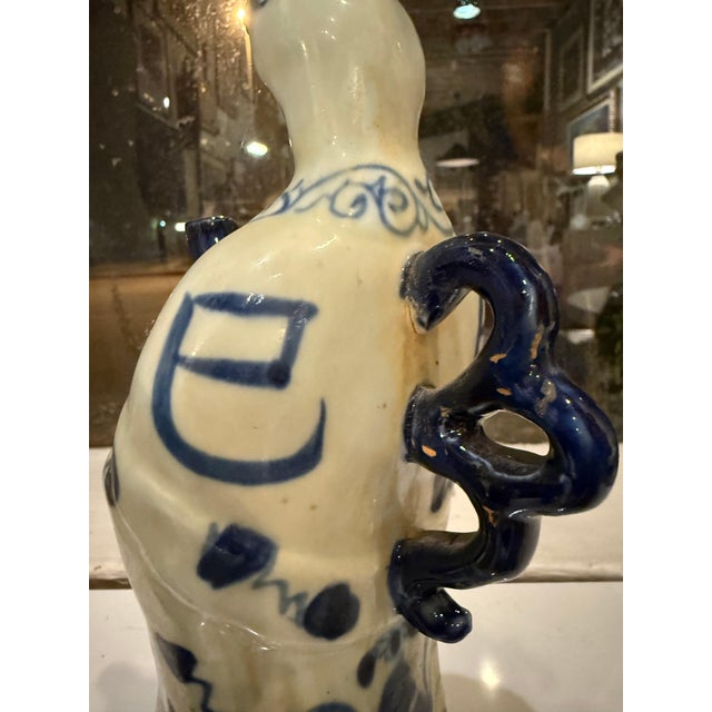 A charming trio of hand-painted ceramic figures, each representing an animal from the Chinese zodiac: the Serpent,...