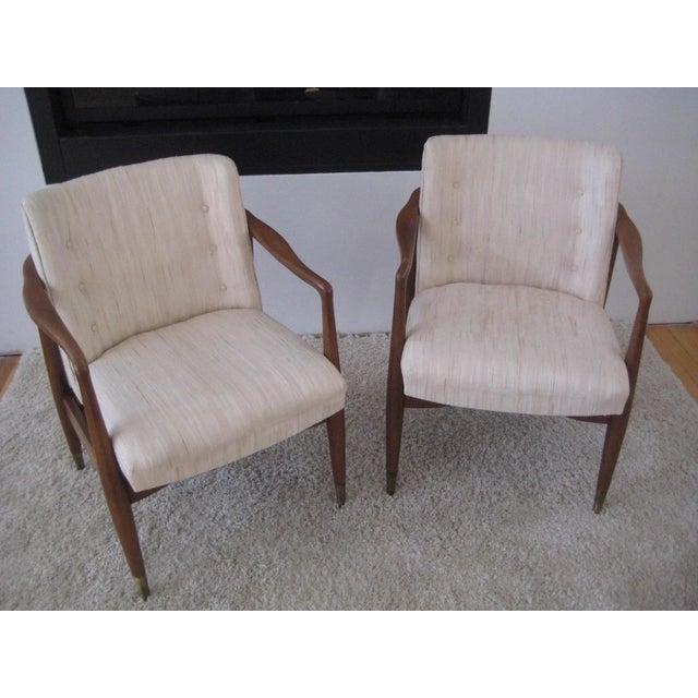 MIDCENTURY pair of open arm Danish Walnut lounge chairs, The backs are beautifully rounded to curving graceful arms.The...