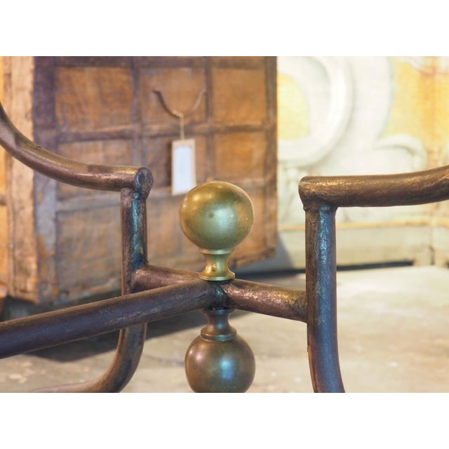 More information coming soon… Measuring over nine feet long, this glass dining table is supported by a wrought iron and...