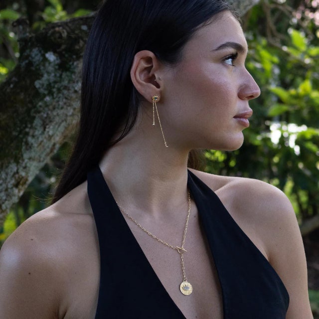 Embrace the magic of the night with the Dreamcatcher Eye Gold Earrings, where protection meets elegance. Crafted from 925...