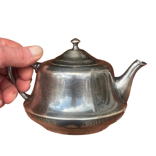 A visually striking and highly functional vintage stacking tea set, perfect for the Mid-Century Modern enthusiast. Crafted...