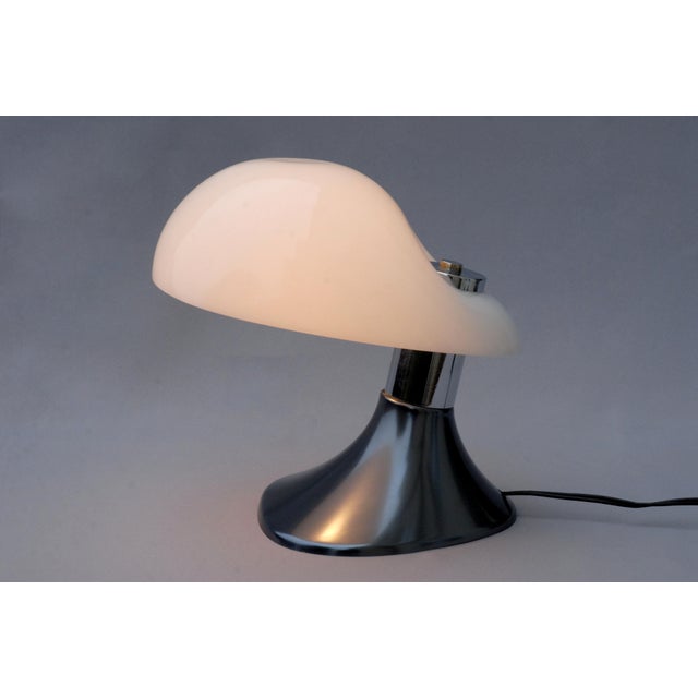 A highly collectible italian table lamp, model cobra, designed by guzzini in the late 1970s. this compact and elegant...