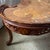 A stunning vintage French Provincial serpentine kidney‑shaped coffee table, crafted with exquisite marquetry inlay and a...