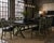 A substantial architectural dining collection featuring a double X-trestle extension table and eight matching X-back...