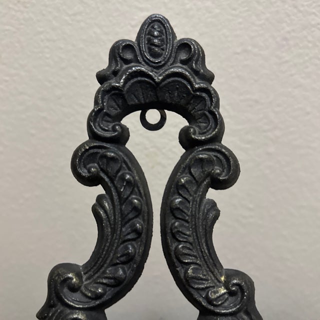 This exquisite 19th-century-style tabletop easel is crafted from heavy cast iron and features an exceptionally ornate...