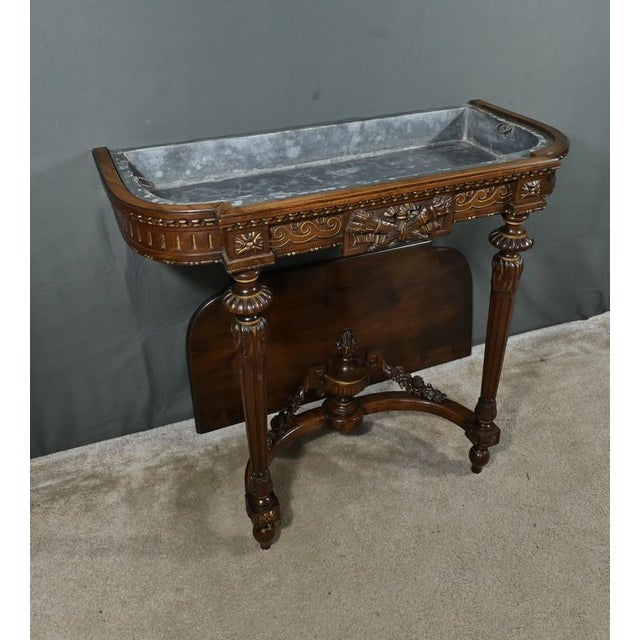 Rare Louis XVI style carved walnut planter characterized by its removable lid revealing a zinc tray. This refined piece of...