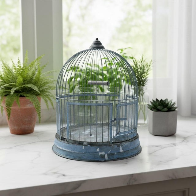 Antique wire birdcage produced by the Hendryx company in New Haven, Connecticut. Early 20th century Features a wire dome-...