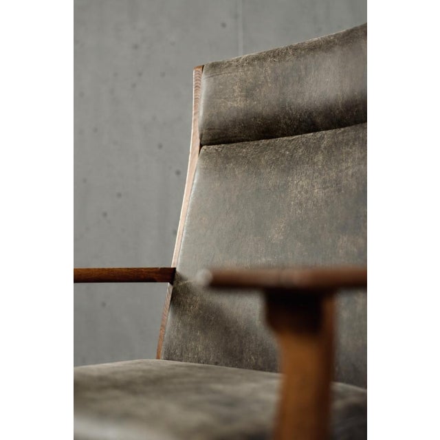 This rare ge-181-a armchair was designed by hans j. Wegner for the danish getama factory during the 1950s. The ergonomic...