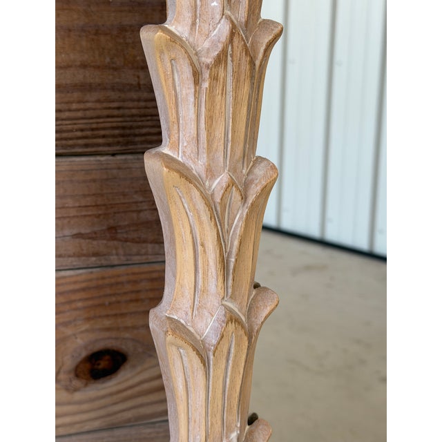 A beautifully carved vintage palm leaf wall mirror by Carolina Mirror Company, featuring layered botanical detailing and...