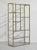 Sleek, glamorous, and architecturally striking, this mid-century étagère features a gold chrome frame paired with glass...
