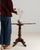 Tilt-top pedestal table in Rich Mahogany. The rich mahogany surface highlights round top, turned tripod base with scroll...