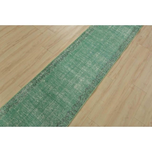 An authentic vintage traditional overdyed Tabriz runner hand-knotted with fine wool and natural dyes. This oriental rug...