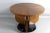 Art Deco Round Guéridon in Three Hinge Walnut resting on a round database of black color. This heedon was restored and we...