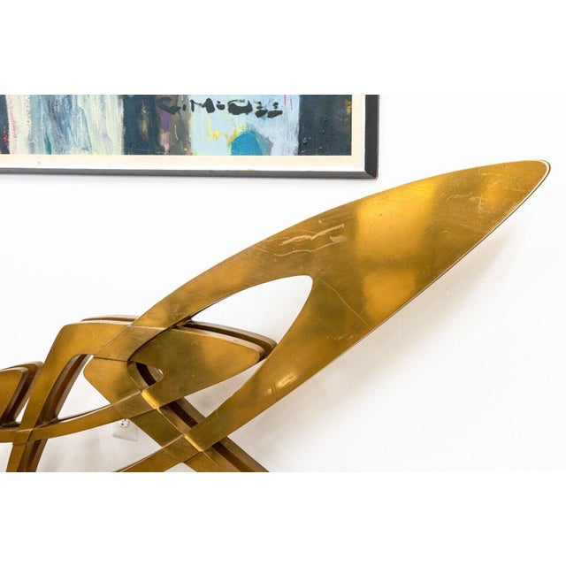 A bronze sculpture on lucite bases titled "Involute Concrescence" by Giorgio Zennaro. Signed and dated 1973 with an...