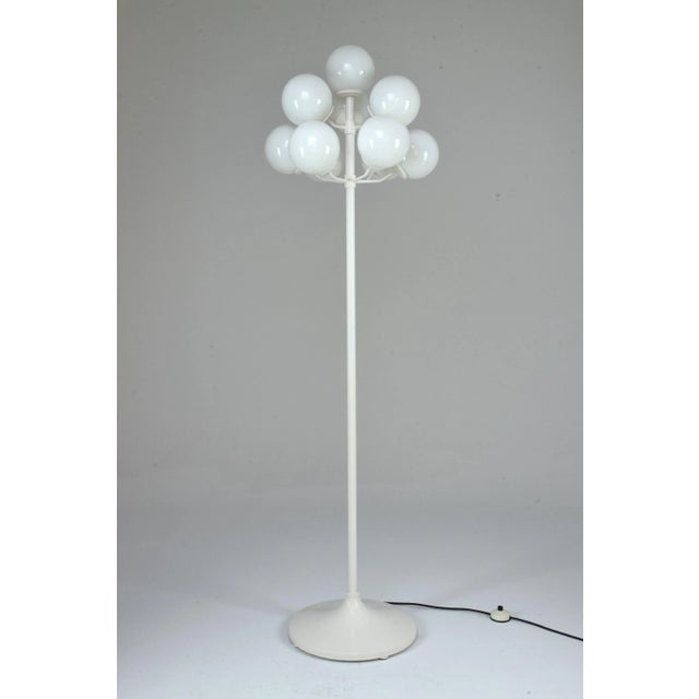 A 1960's vintage floor lamp in the style of Swedish designer Max Bill's iconic design. This piece is built with 10 atomic...