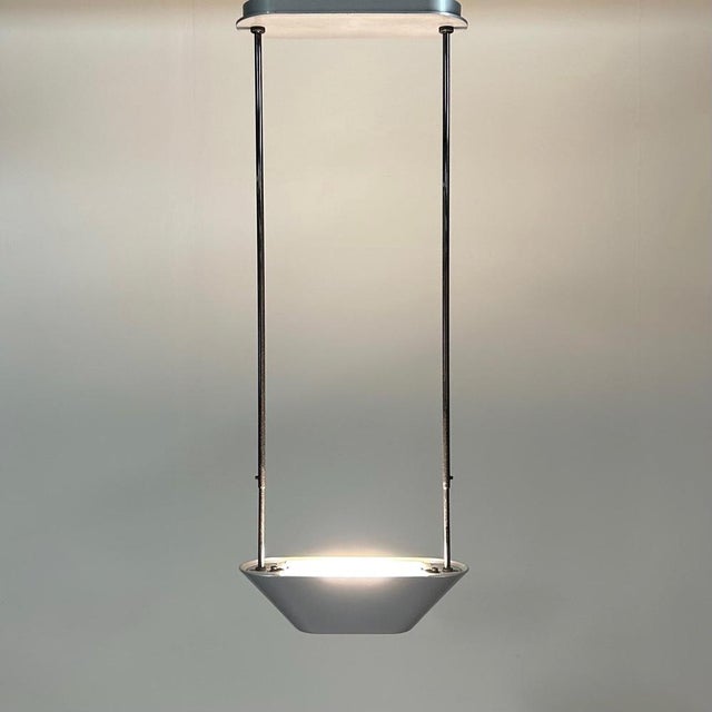 Silver pendant lamp sidone designed by de pas, durbino & lomazzi for artemide, 1980s. The pendant is made of chromed metal...