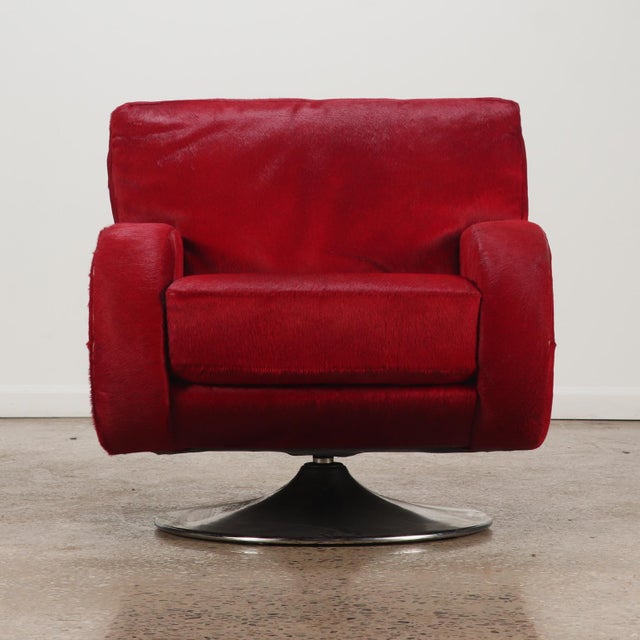 A bold statement in Space Age luxury and materials, this robust lounge chair features an overstuffed, enveloping barrel...