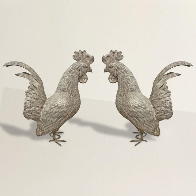 Striking in both scale and detail, this pair of life-size cast brass roosters commands attention with their bold presence...