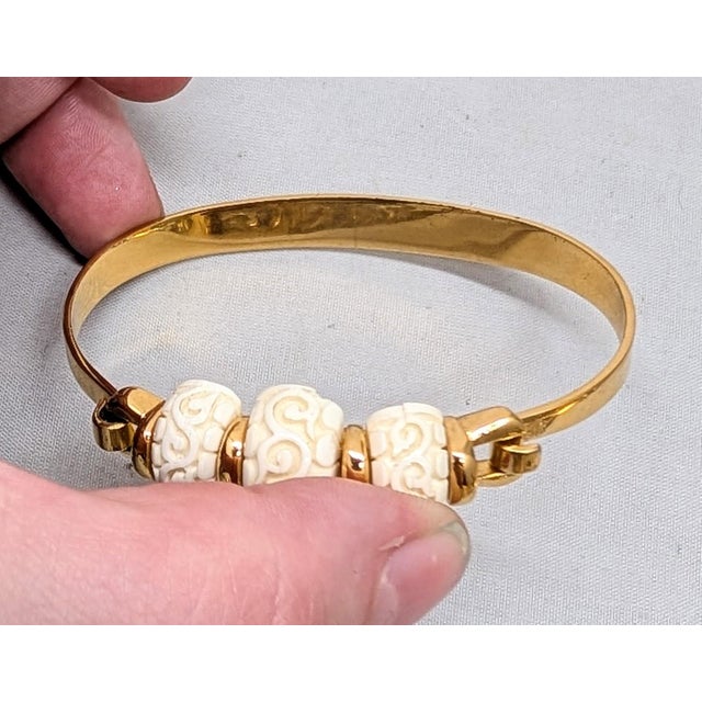 Vintage Signed Crown Trifari Goldtone Carved Faux-Ivory Cuff Bracelet For Sale - Image 11 of 12