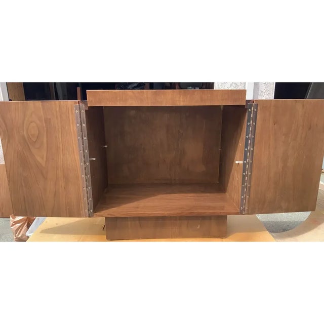 Mid century style walnut nightstand. Stand has been refinished. Stand has 2 doors. Stand also has a shelf. Excellent...