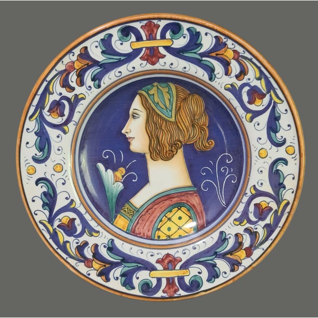 This Vintage Italian Deruta Majolica Painted Renaissance Portrait Decorative Plate is a beautifully handcrafted...