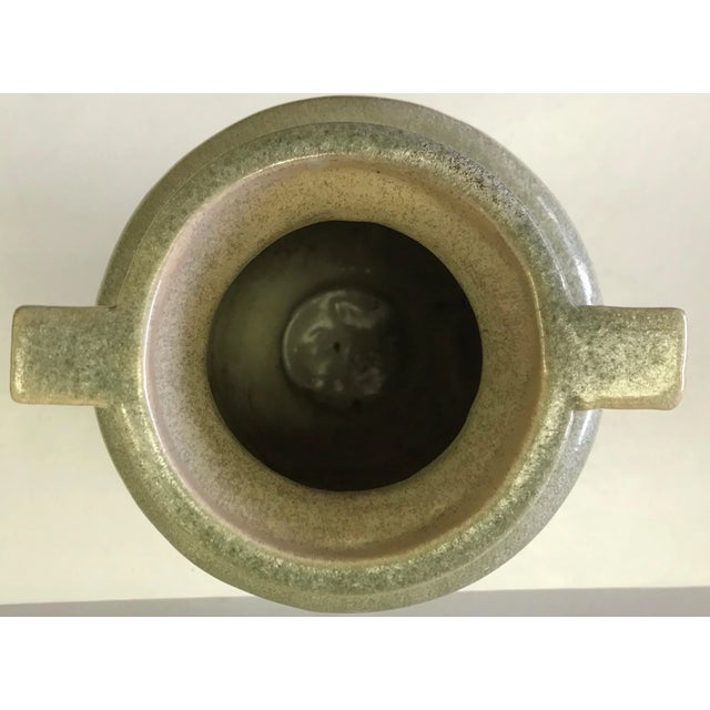 Simple and elegant Egyptian Revival ceramic urn vase. This wheel turned vase has a lovely jade green celadon crystal glaze...