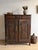 A remarkable late 19th-century French oak cabinet distinguished by its taller, more architectural proportions and finely...